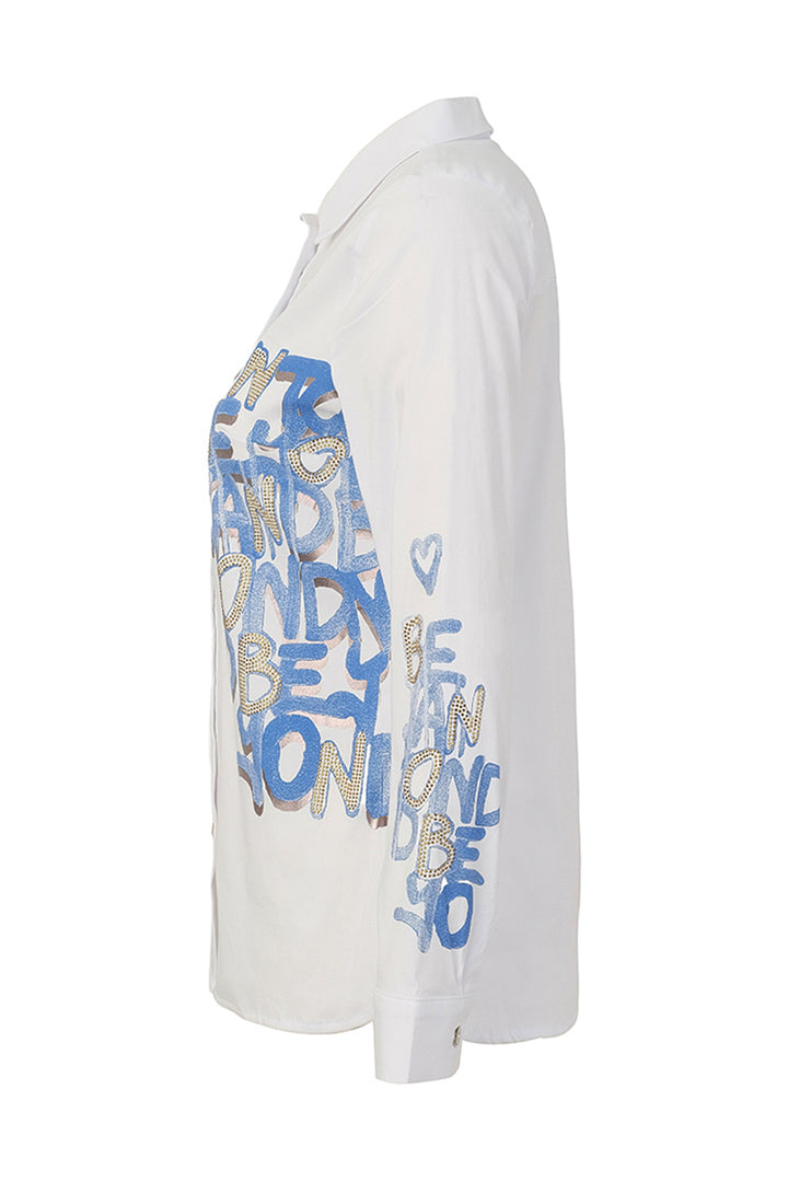 A white long-sleeve button-up shirt shown from the side, featuring blue and gold graffiti-style text graphics on the front and sleeve.