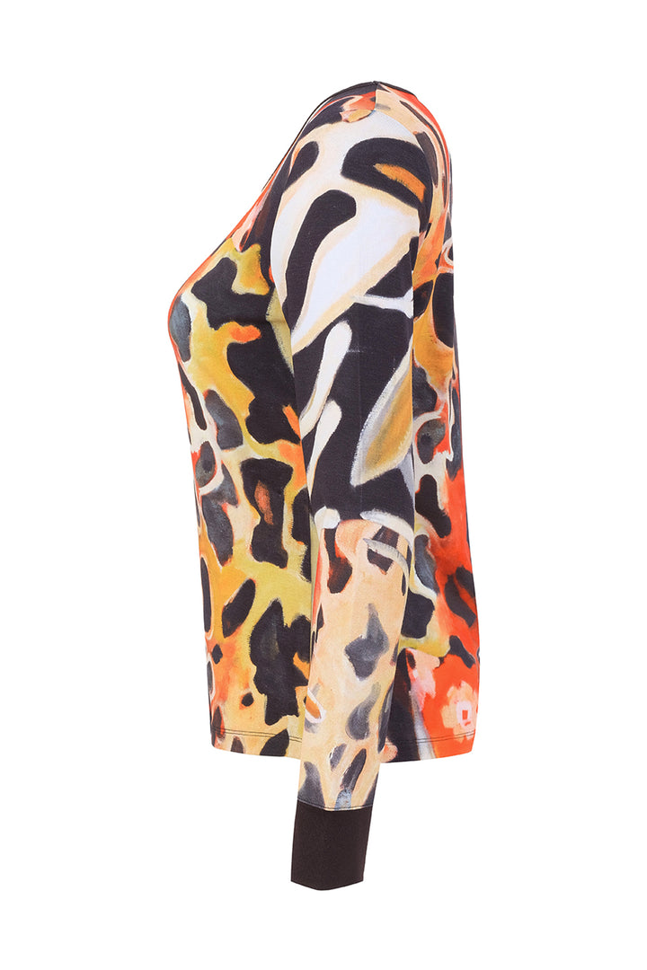 A long-sleeve top with an abstract, painterly animal-inspired pattern in orange, black, yellow, and white, shown from a side profile view on a white background.