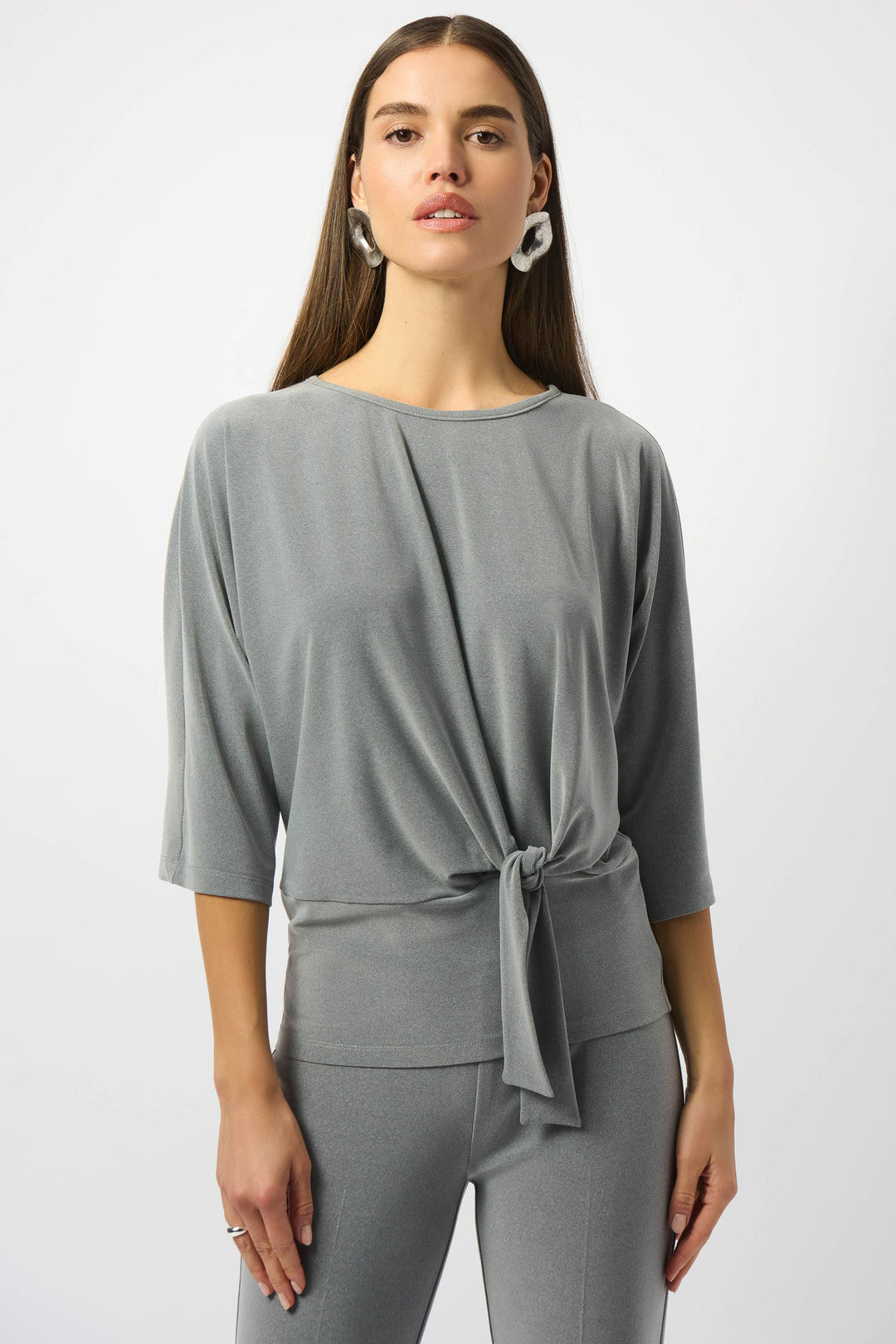 Joseph Ribkoff Fall 2025 
Crafted from silky knit fabric, it offers a soft, smooth touch against the skin. The 3/4 length sleeves and scoop neckline contribute to a relaxed yet refined silhouette, making it perfect for both casual and dressier occasions.