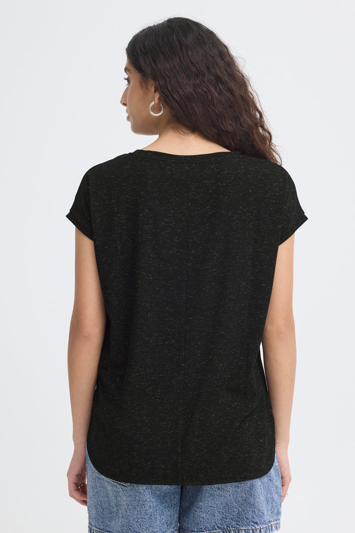Person wearing a black t-shirt and blue jeans on a white background