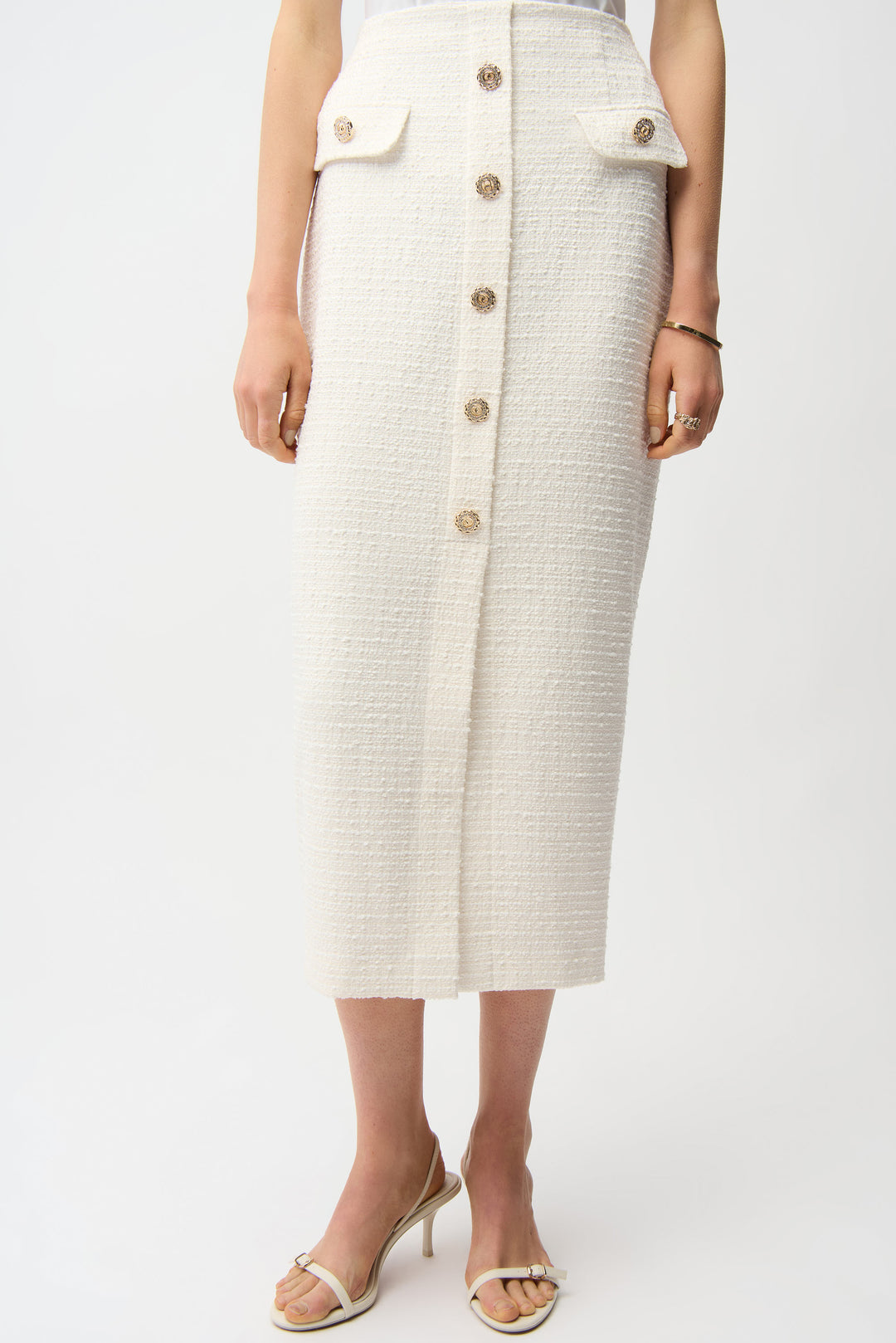 Person wearing a white button-up skirt on a white background