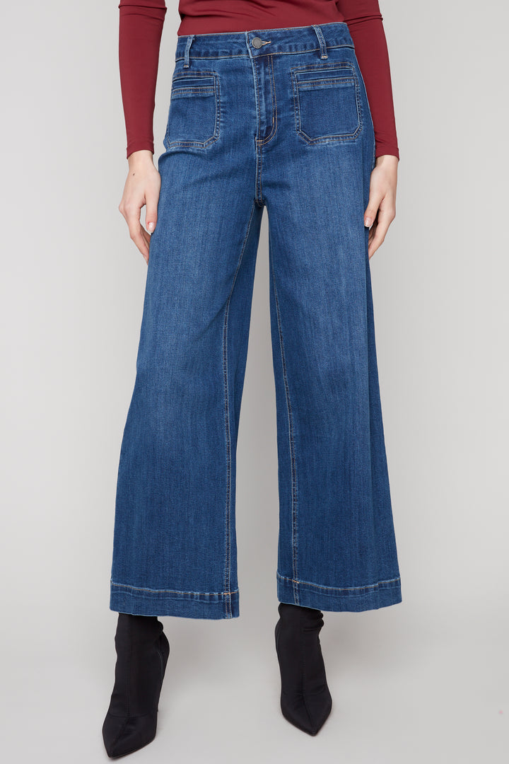 Charlie B Fall 2025 
 The modern flare hem design adds a stylish twist to the classic jean pant. With a regular rise and front patch pockets, these jeans are both functional and trendy. 