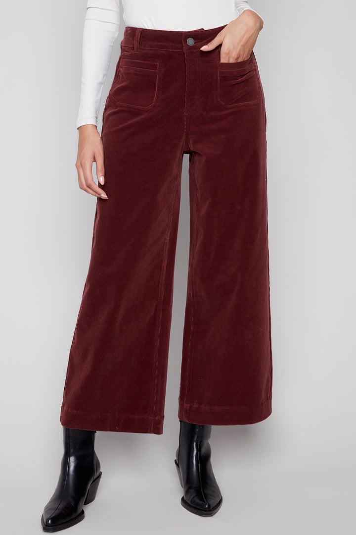 Charlie B Fall 2025 
These cropped corduroy pants feature distinctive front patch pockets and a soft cotton blend for comfort. The wide flare hem adds a fashionable edge, making them a versatile choice for elevating casual and smart-casual looks alike.