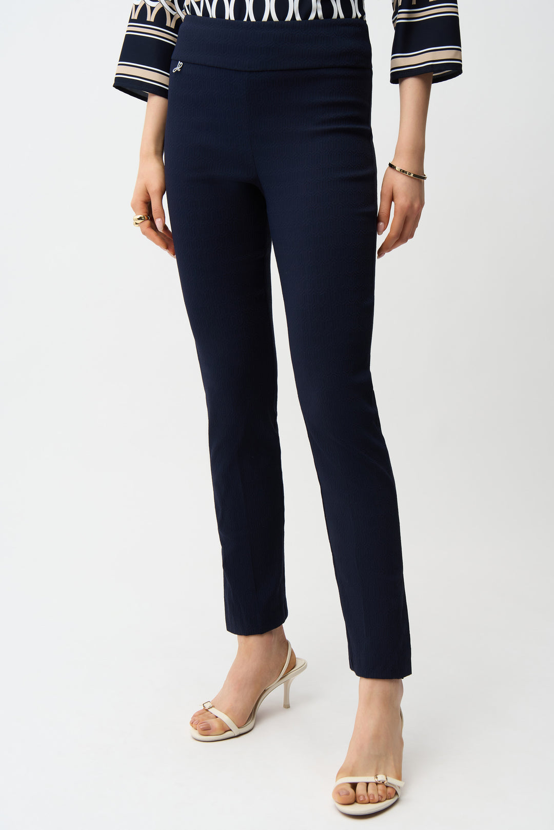 JOSEPH RIBKOFF Spring 2026 
Elevate your wardrobe with these jacquard straight leg pants, designed for versatile sophistication. Featuring a comfortable pull-on elastic waist and unlined construction for effortless movement, these pants showcase striking side leg slits that add contemporary flair.