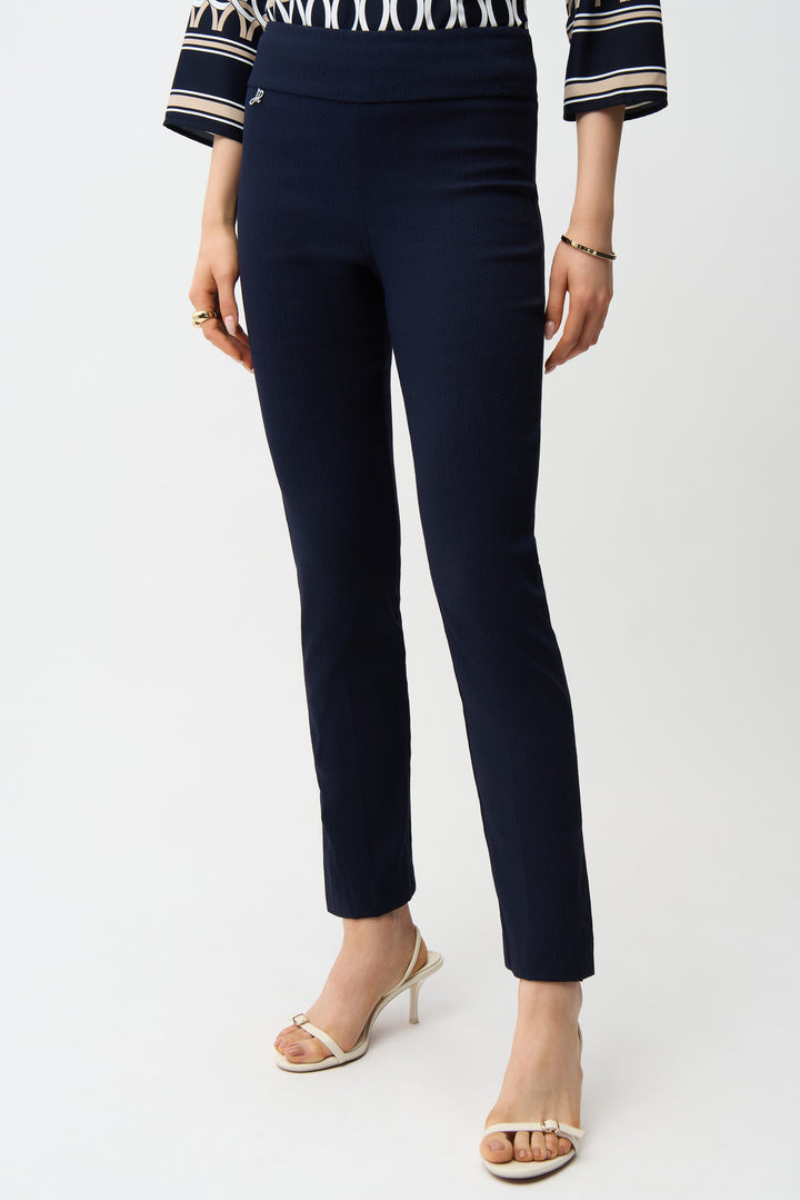 JOSEPH RIBKOFF Spring 2026 
Elevate your wardrobe with these jacquard straight leg pants, designed for versatile sophistication. Featuring a comfortable pull-on elastic waist and unlined construction for effortless movement, these pants showcase striking side leg slits that add contemporary flair.