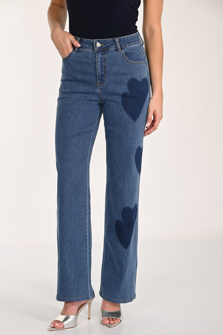 Blue jeans with heart shapes on a white background