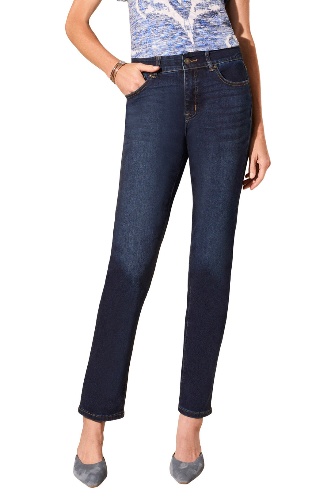 Person wearing dark blue jeans on a white background