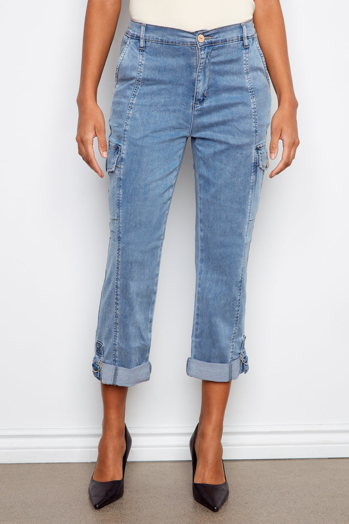 Light blue cargo jeans worn by a person on a white background