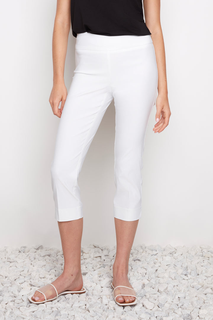 Person wearing white pants on a light gray background