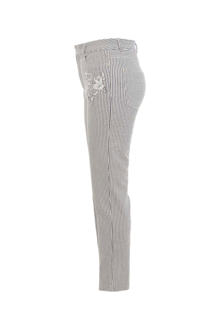 Black and white striped pants with floral embroidery on a white background
