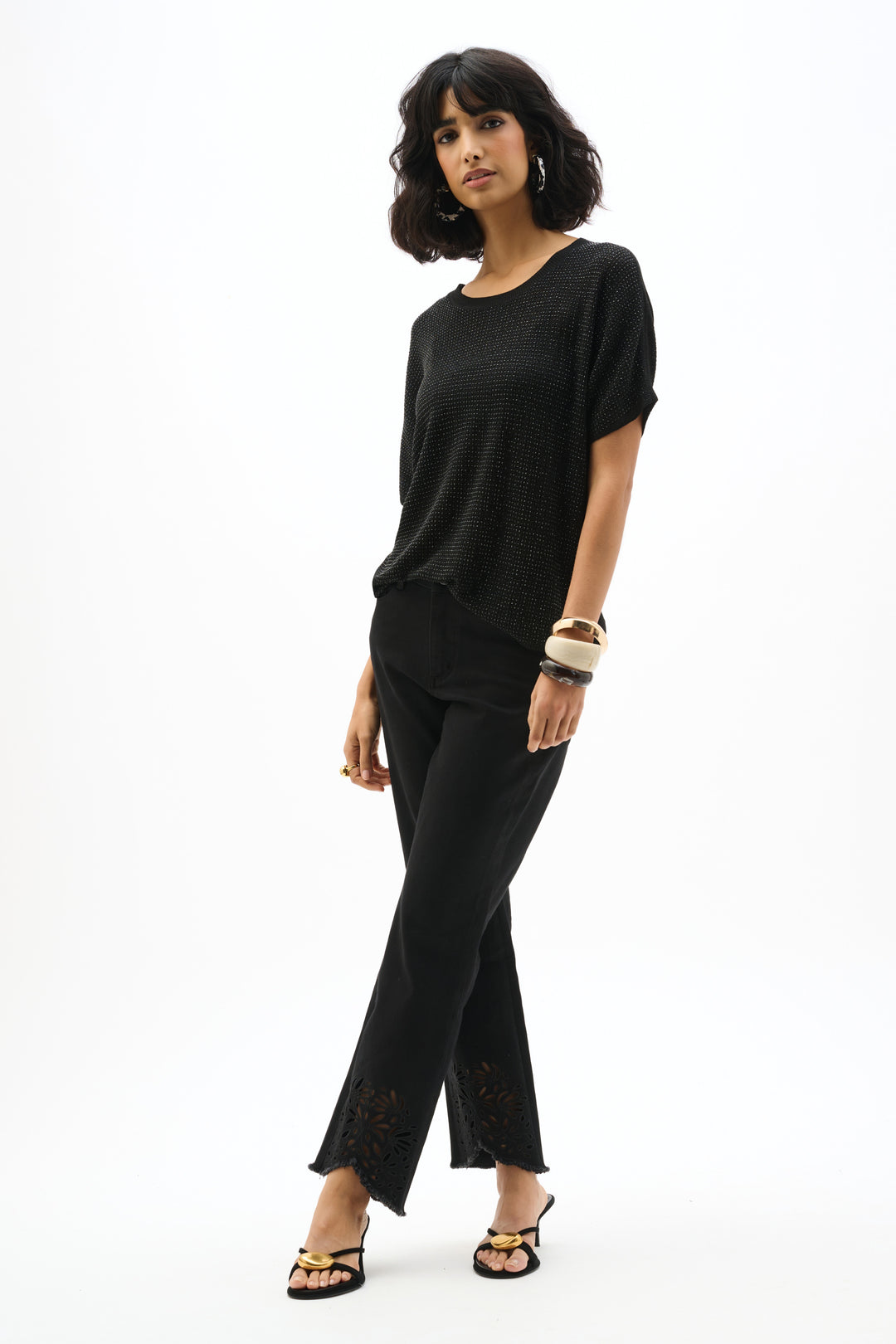 Woman wearing a black outfit on a white background