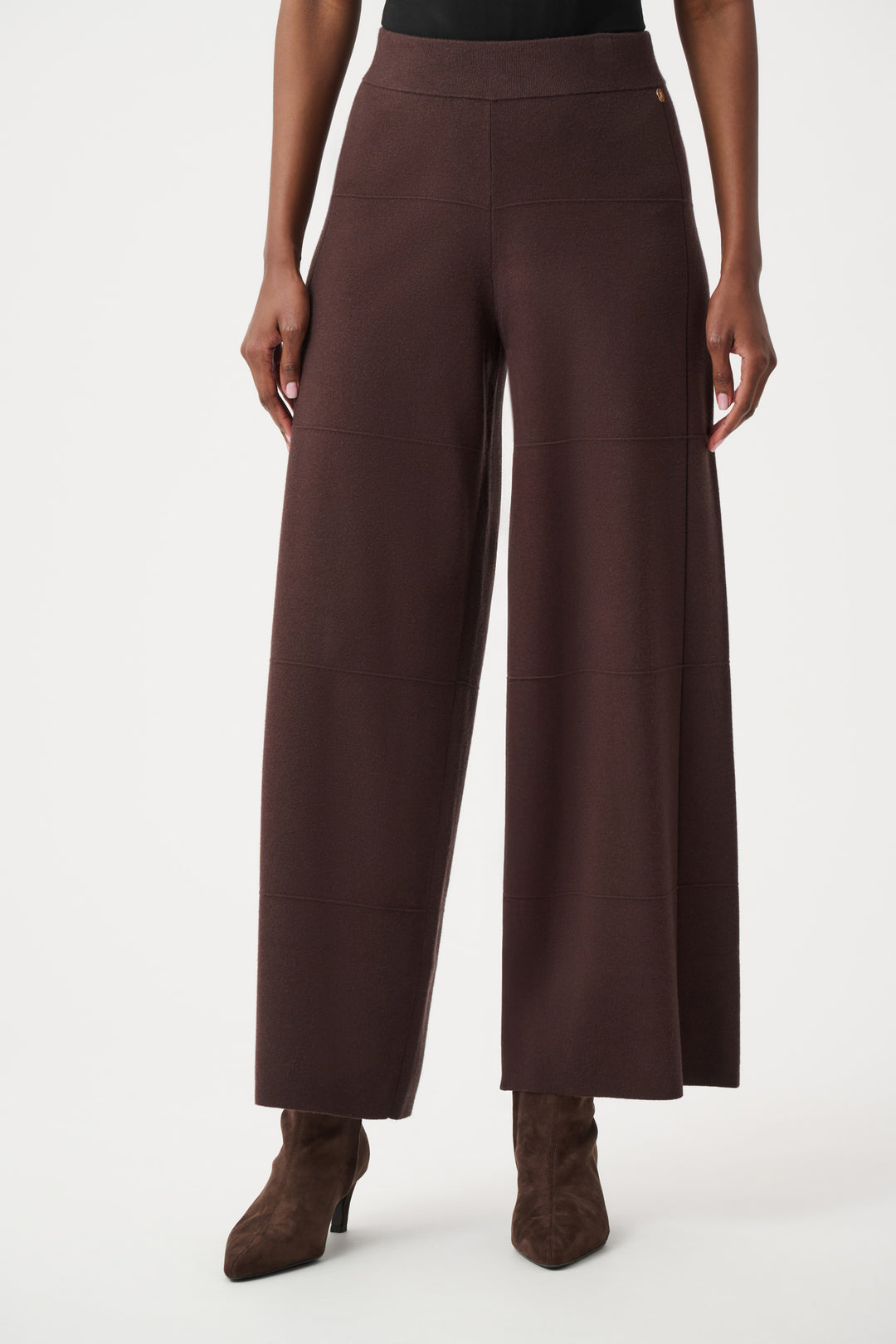 Brown wide-leg pants worn by a person on a white background