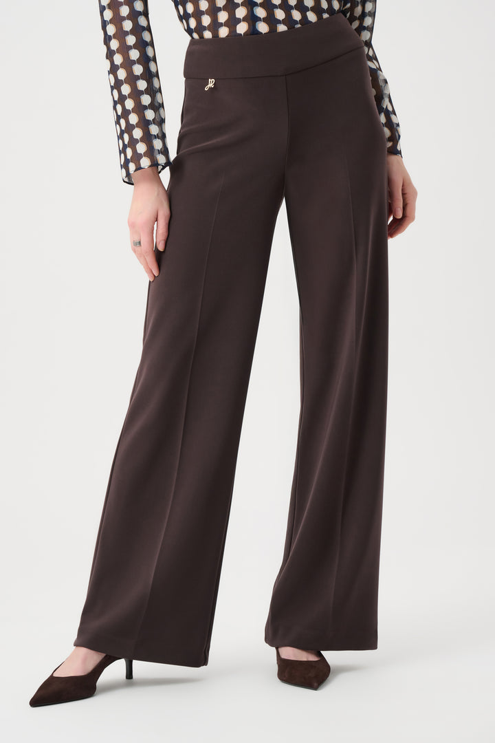 Brown wide-leg pants worn by a person on a white background