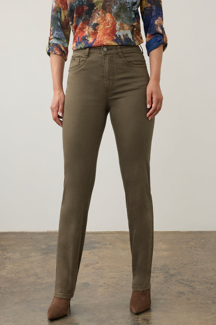 A model wearing slim-fit olive green pants, paired with a colorful floral long-sleeve top and brown pointed-toe heels, standing against a neutral studio background.