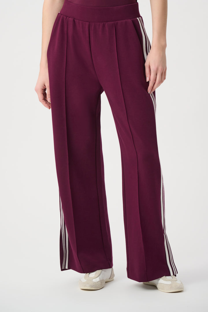 Maroon wide-leg pants with white stripes on a white background