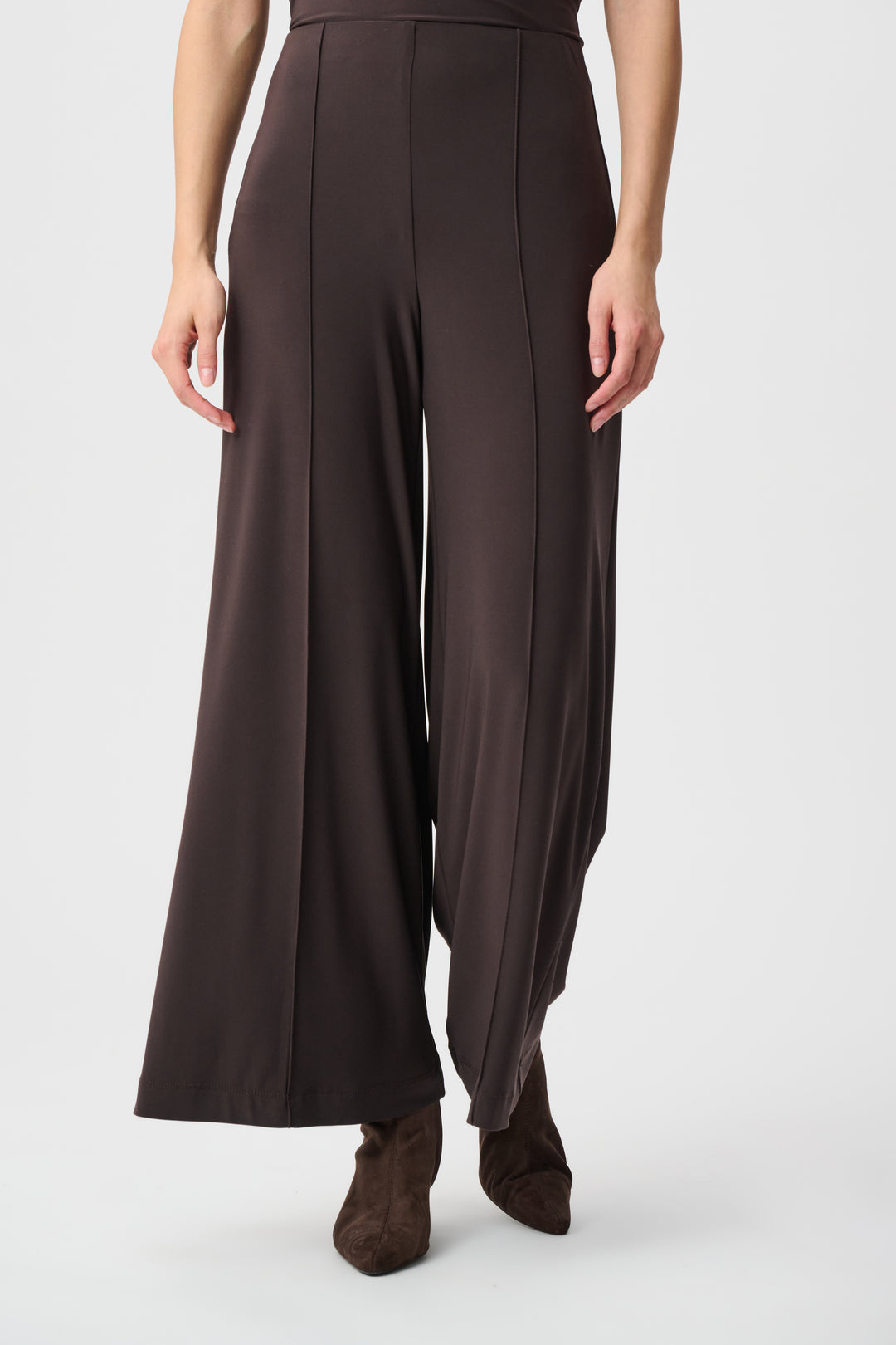Brown wide-leg pants worn by a person on a white background