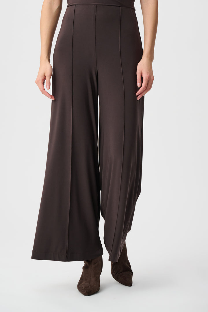 Brown wide-leg pants worn by a person on a white background