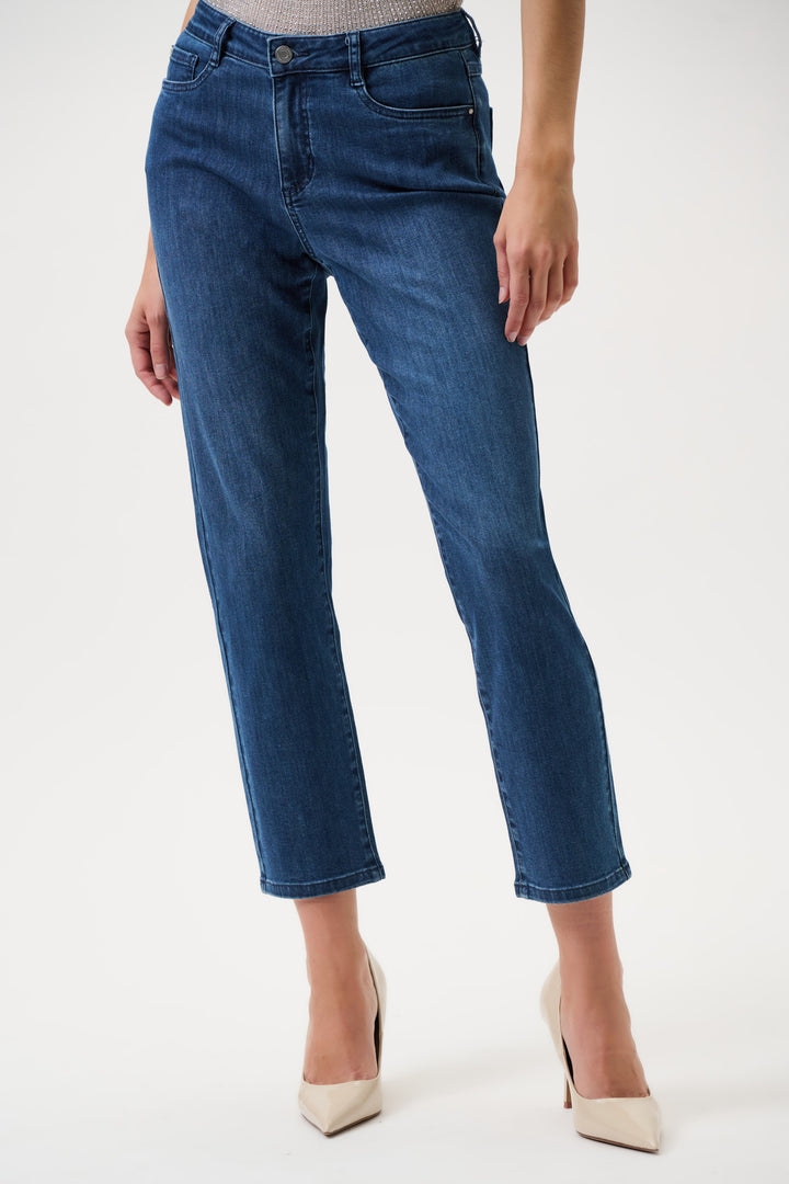 Blue jeans worn by a person on a white background