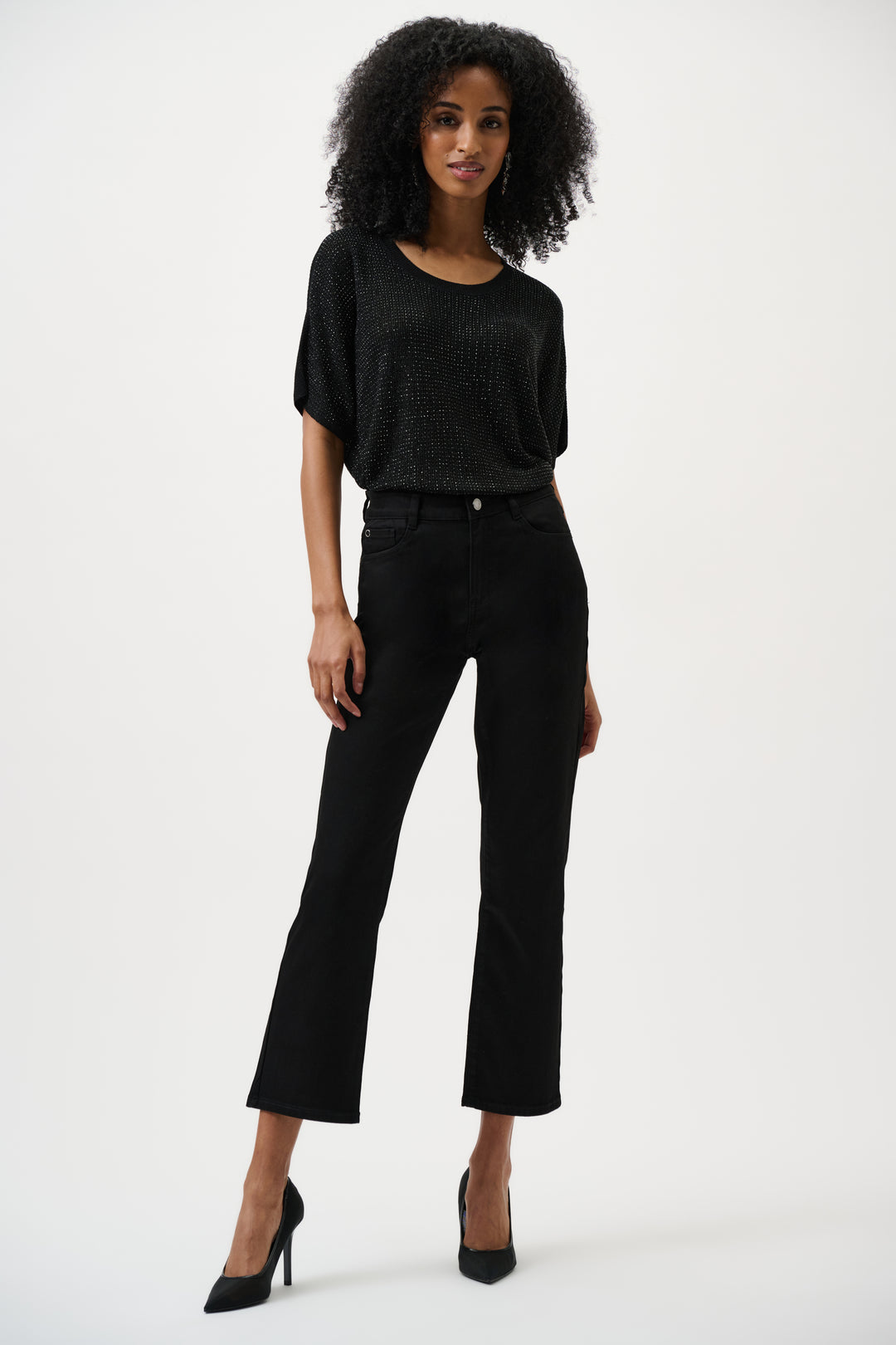 Woman wearing a black outfit on a white background