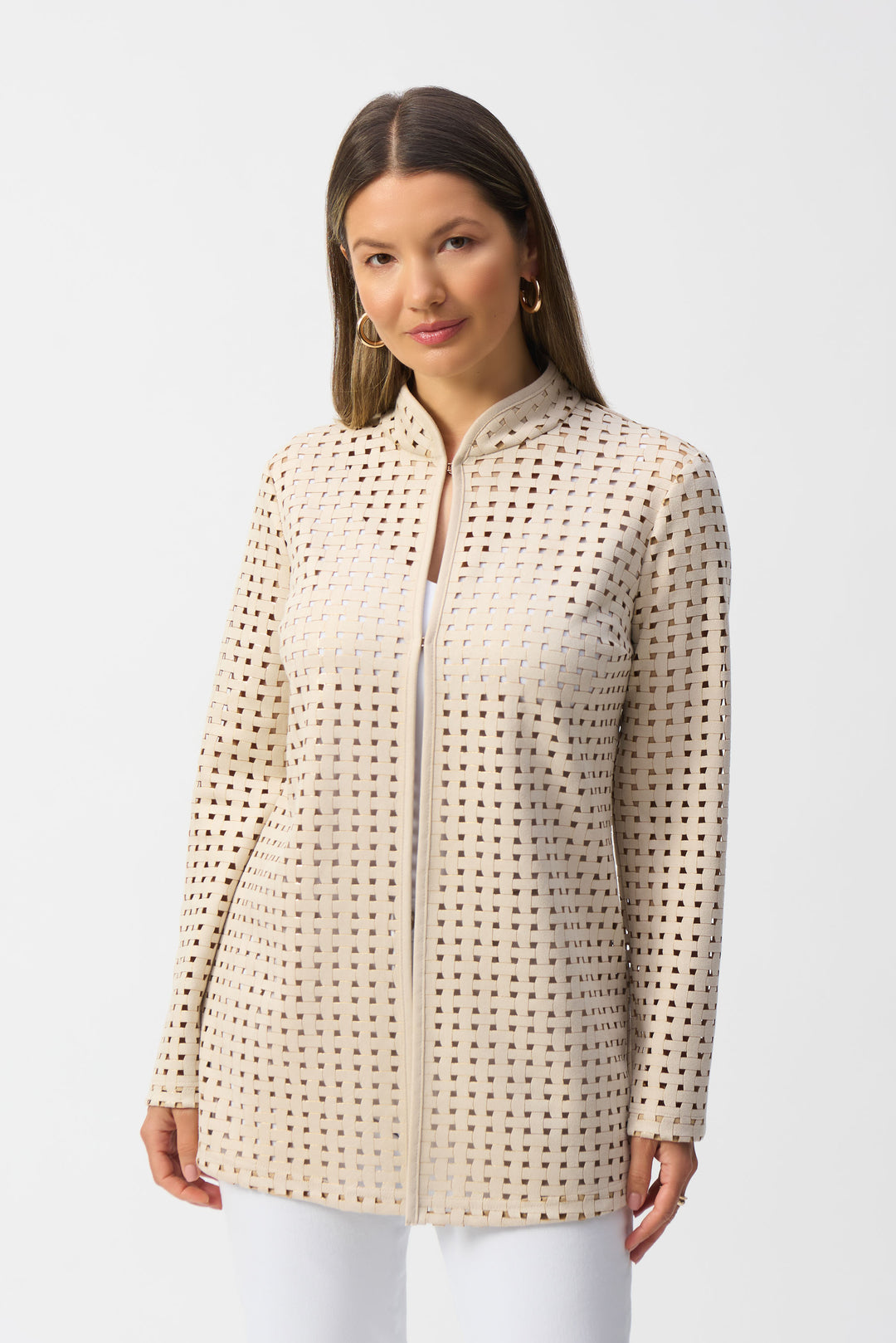 Joseph Ribkoff Spring 2025 Its figure-flattering silhouette and good stretch make it perfect for layering over any top, while its intricately woven design with laser cut pattern adds a touch of artistry.