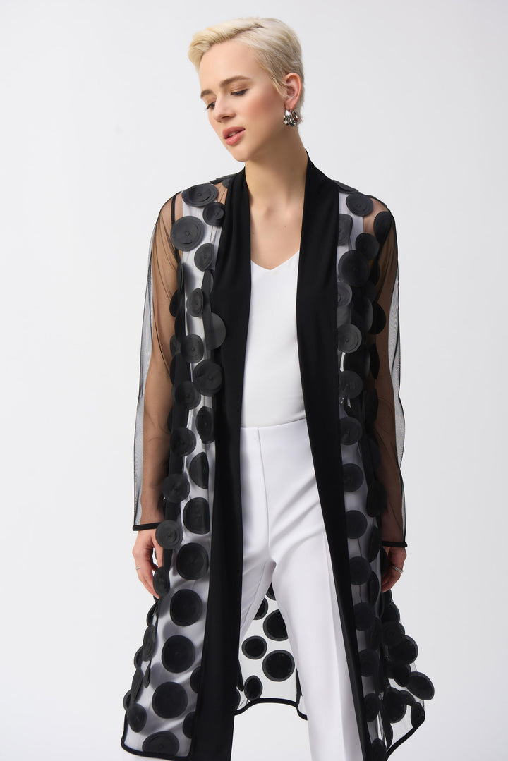 Joseph Ribkoff Spring 2025 Its open style allows for effortless layering over any top or blouse, while the flowing, loose fit offers comfort and style. With playful polka dots and a light weight, this cardigan is a must-have for any fashion-forward individual.