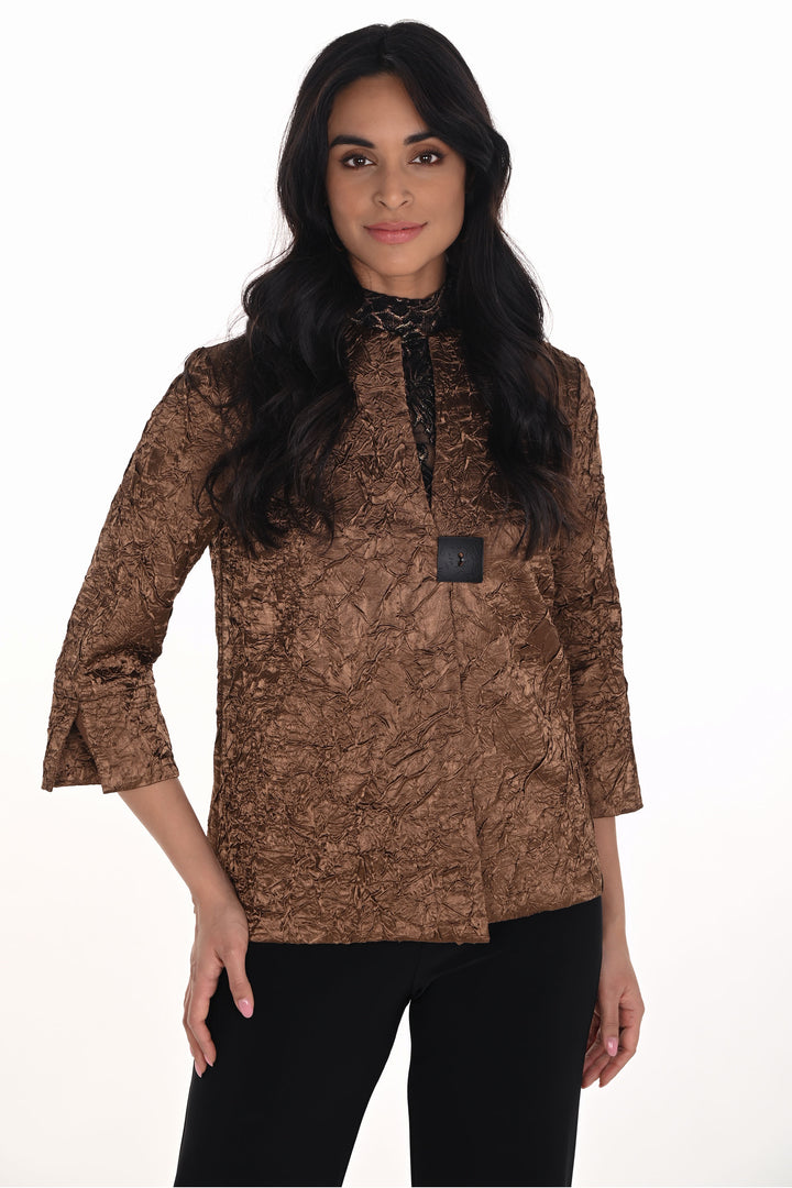 Frank Lyman Fall 2025 
Elevate your style with the Copper Crinkle Textured Jacket, featuring a sophisticated crinkle design that adds refined texture to any outfit. The chic single square button closure offers a modern touch, while half straight sleeves with open cuffs create a sleek, effortless look. 