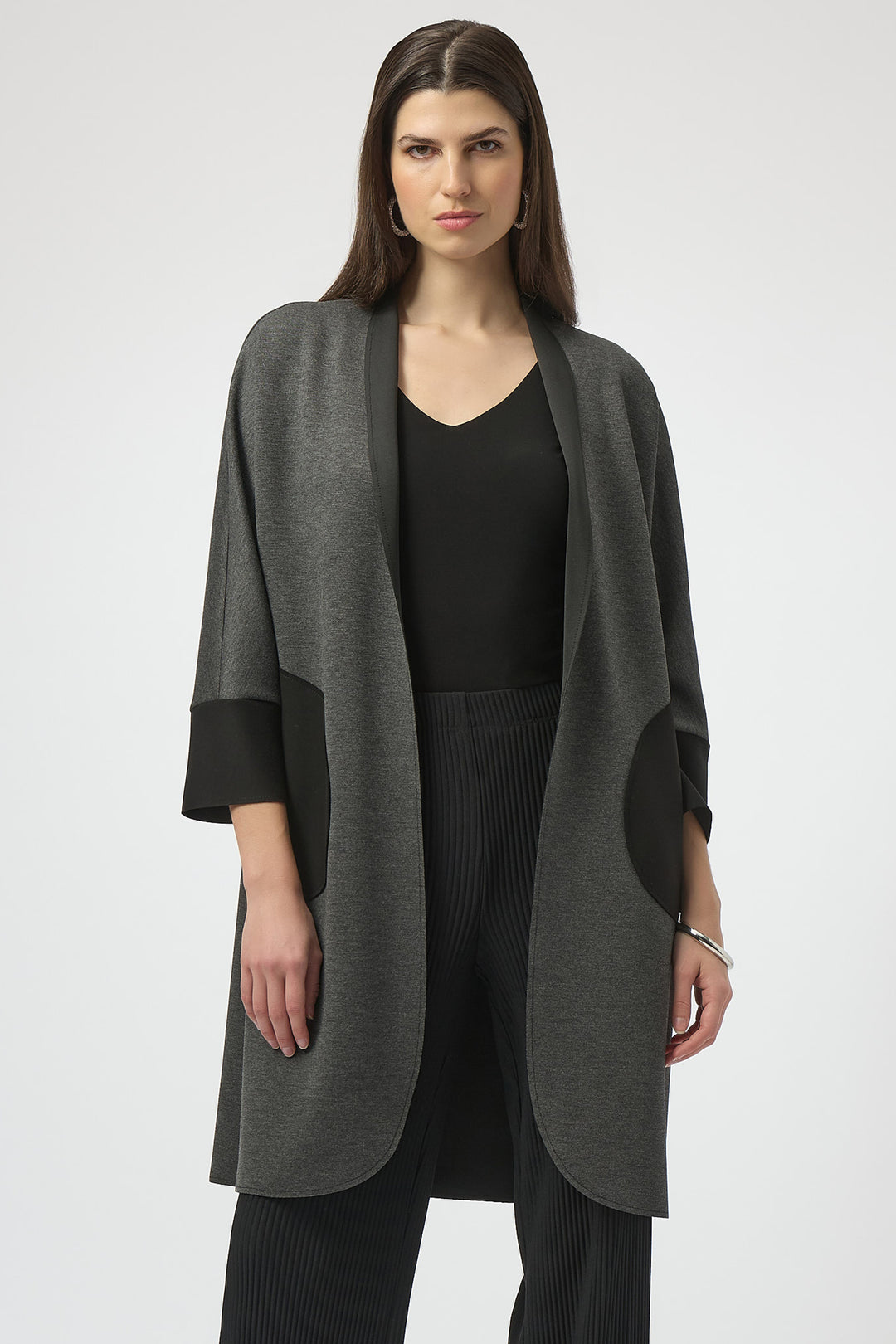 Joseph Ribkoff Fall 2025 
 The open front style and contrast cuffs and pockets add a touch of elegance to this casual style, while the relaxed fit provides both comfort and functionality. 