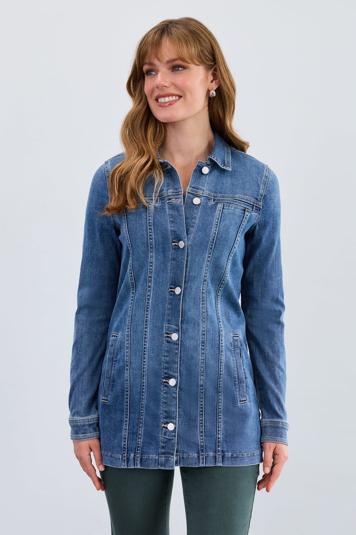 Woman wearing a blue denim jacket on a light gray background