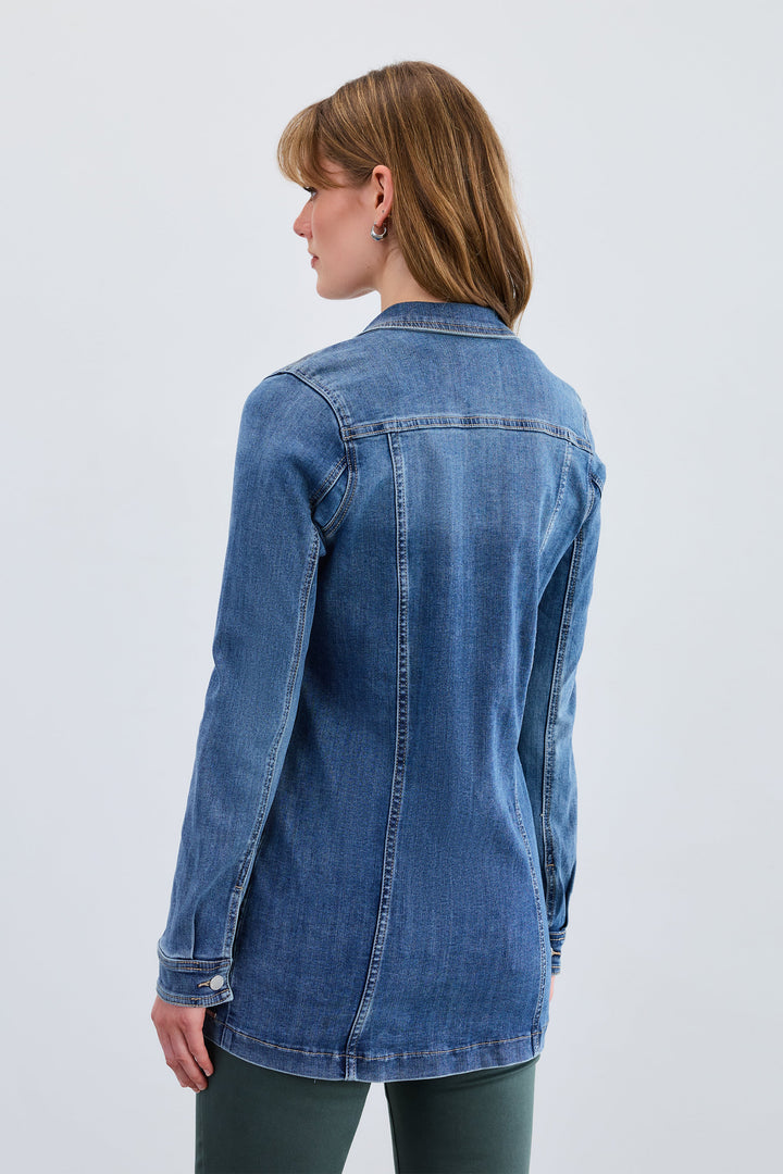 Woman wearing a blue denim jacket on a white background