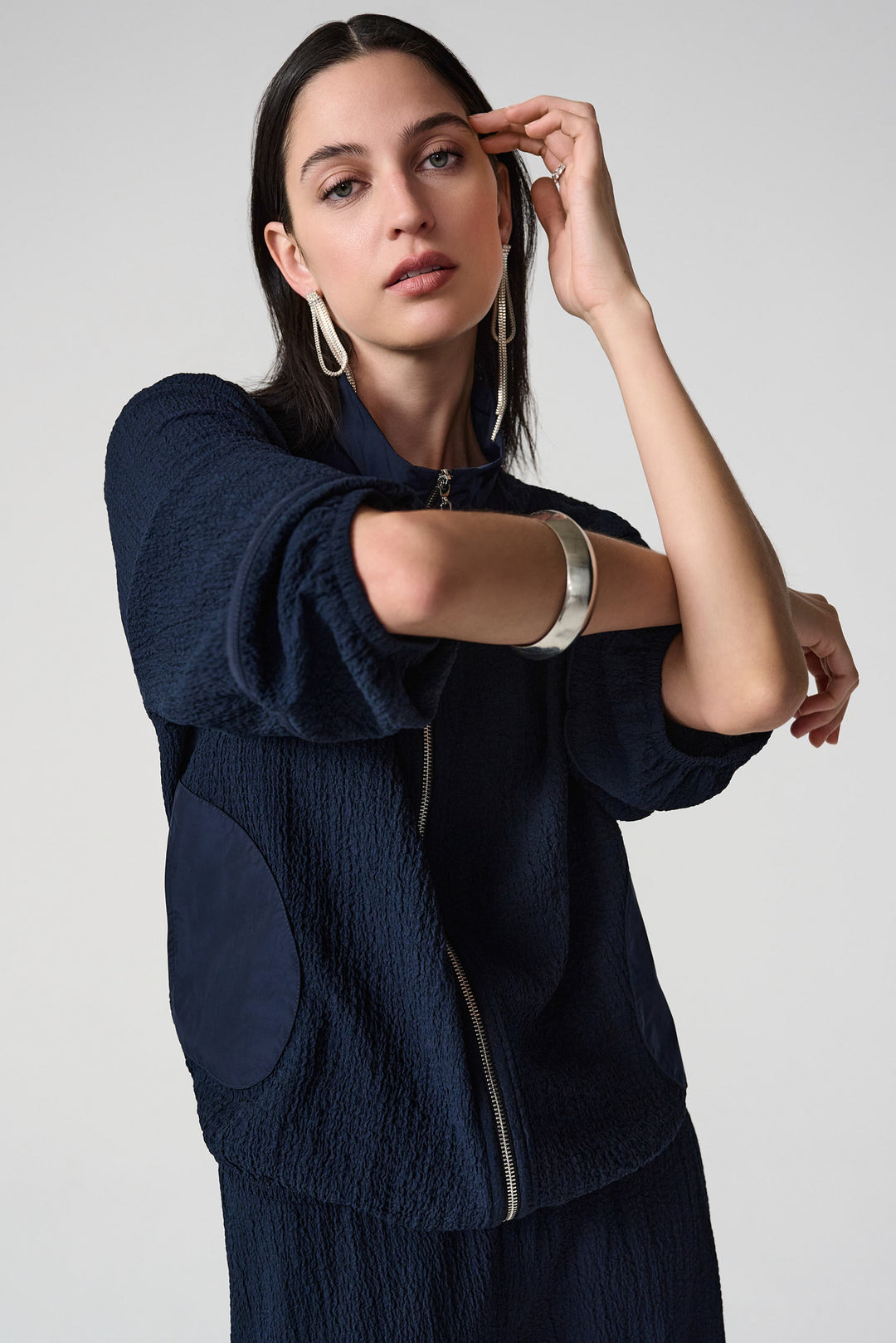 JOSEPH RIBKOFF Spring 2026 
 The textured seersucker fabric pairs seamlessly with responsive memory material, creating a piece that moves with you. 