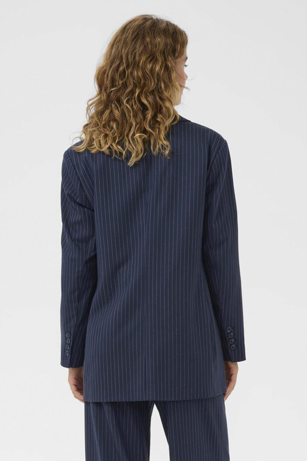 Navy pinstripe suit on a white background