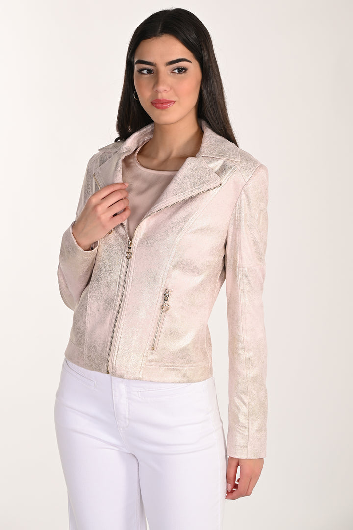 Woman wearing a light-colored leather jacket on a white background