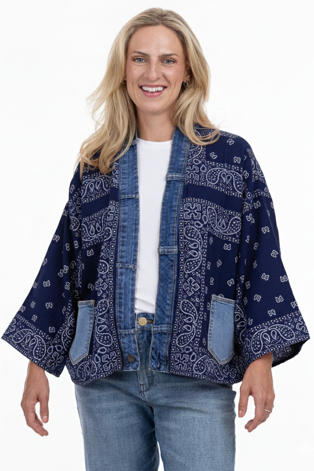 Woman wearing a blue pattern open front cardigan on a white background