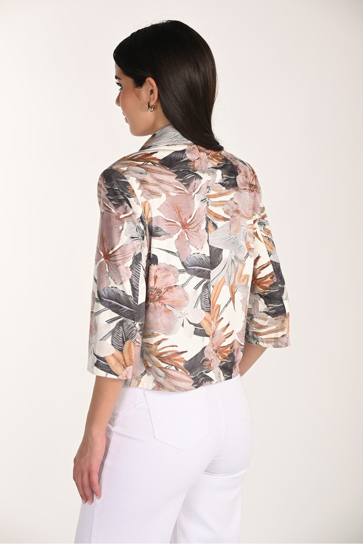 Woman wearing a floral light zipper jacket with a white background