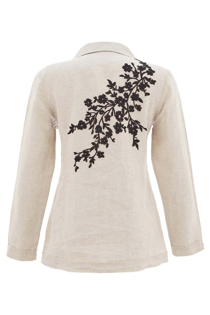Beige jacket with black floral embroidery on the back against a white background