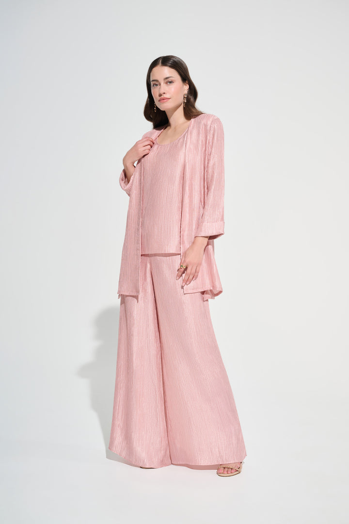 Woman wearing a pink outfit on a white background