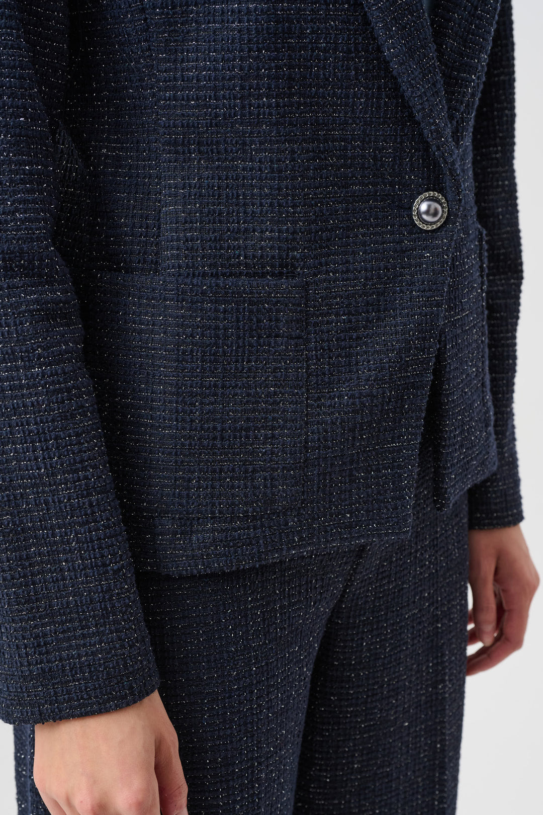 Navy blue textured blazer on a white background