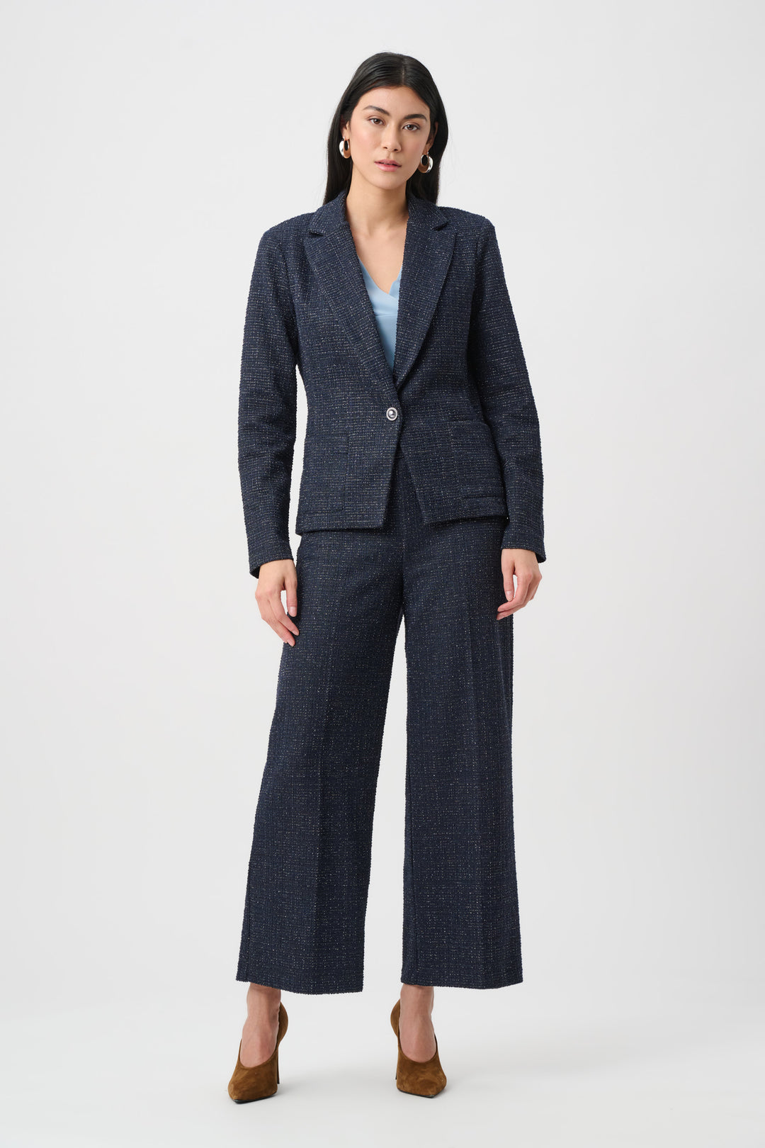 Woman wearing a dark blue suit on a white background