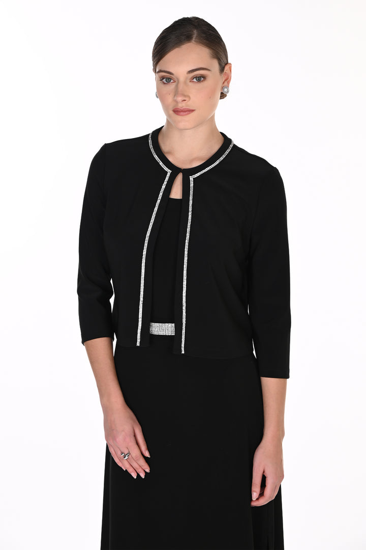 A woman modeling a black three-quarter sleeve dress with silver rhinestone trim along the neckline, front keyhole, and waistband, set against a plain white studio background.