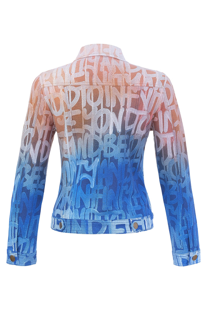 A cropped long-sleeve denim jacket with a white graffiti-style text print featuring the word &