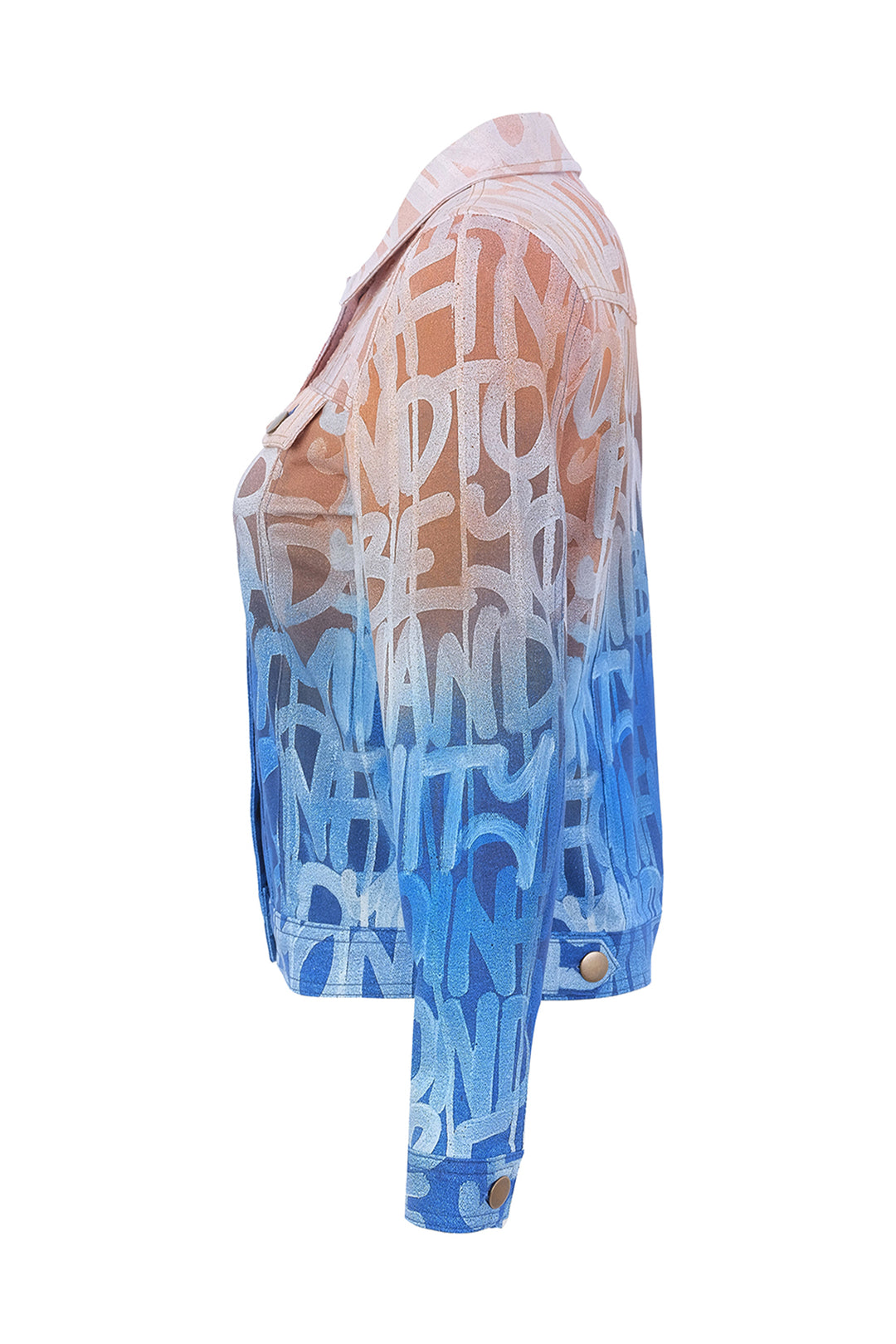 A cropped denim jacket shown from the side profile against a solid white background, featuring a blue-to-pink gradient with white graffiti-style lettering.