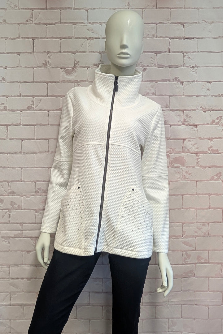 A mannequin wearing an off-white textured zip-up jacket with a high stand collar and decorative rhinestone patterns on the lower front