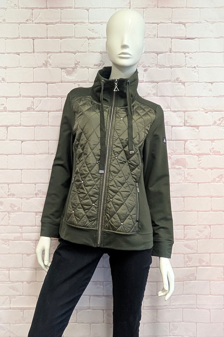 A mannequin wearing a olive green hooded jacket with a ribbed knit body and quilted chest panel.