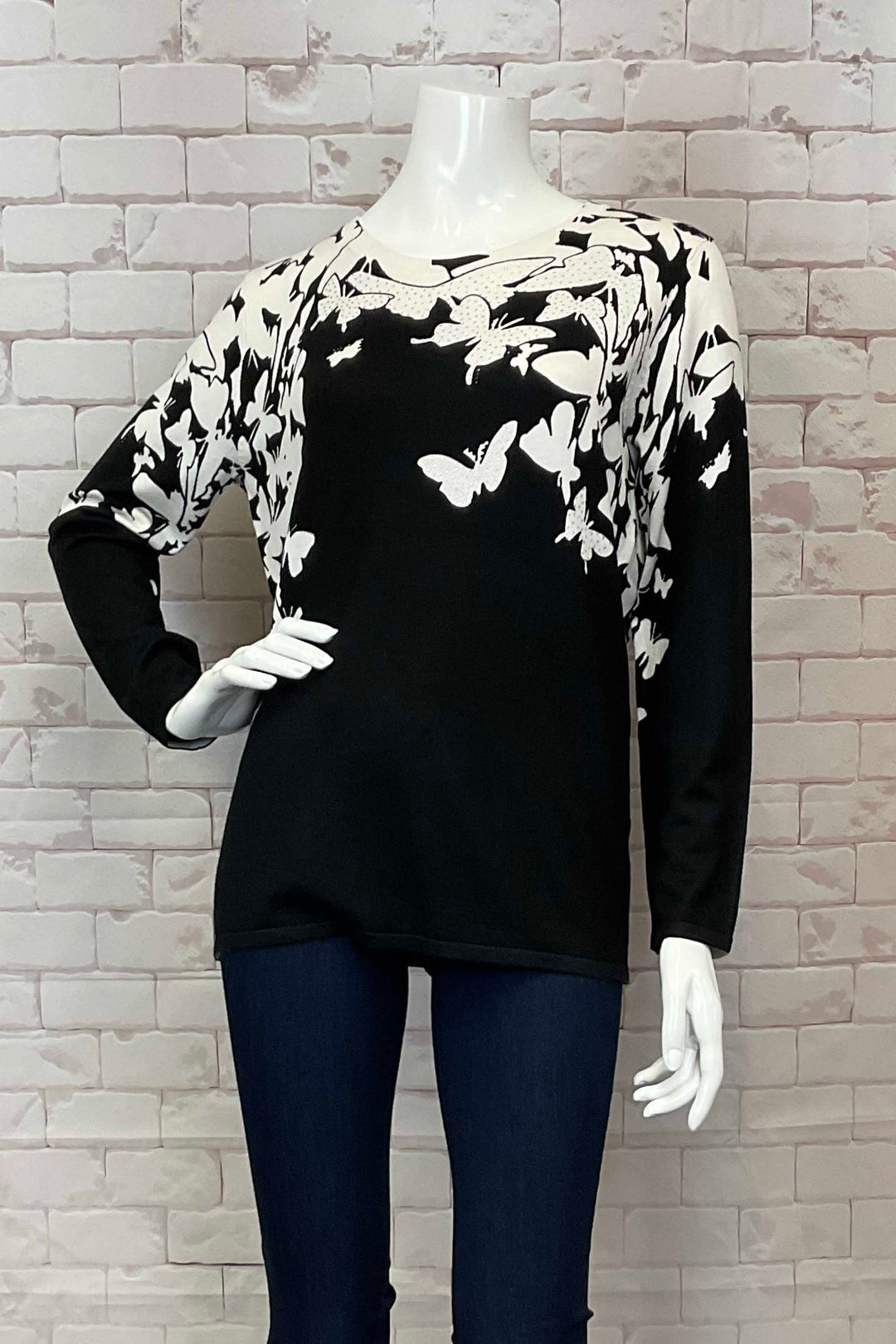 Ness Fall 2024 Made from light knit sweater material, this sweater top features a soft cut v-neck and a neat contrast butterfly print on the front and sleeves.