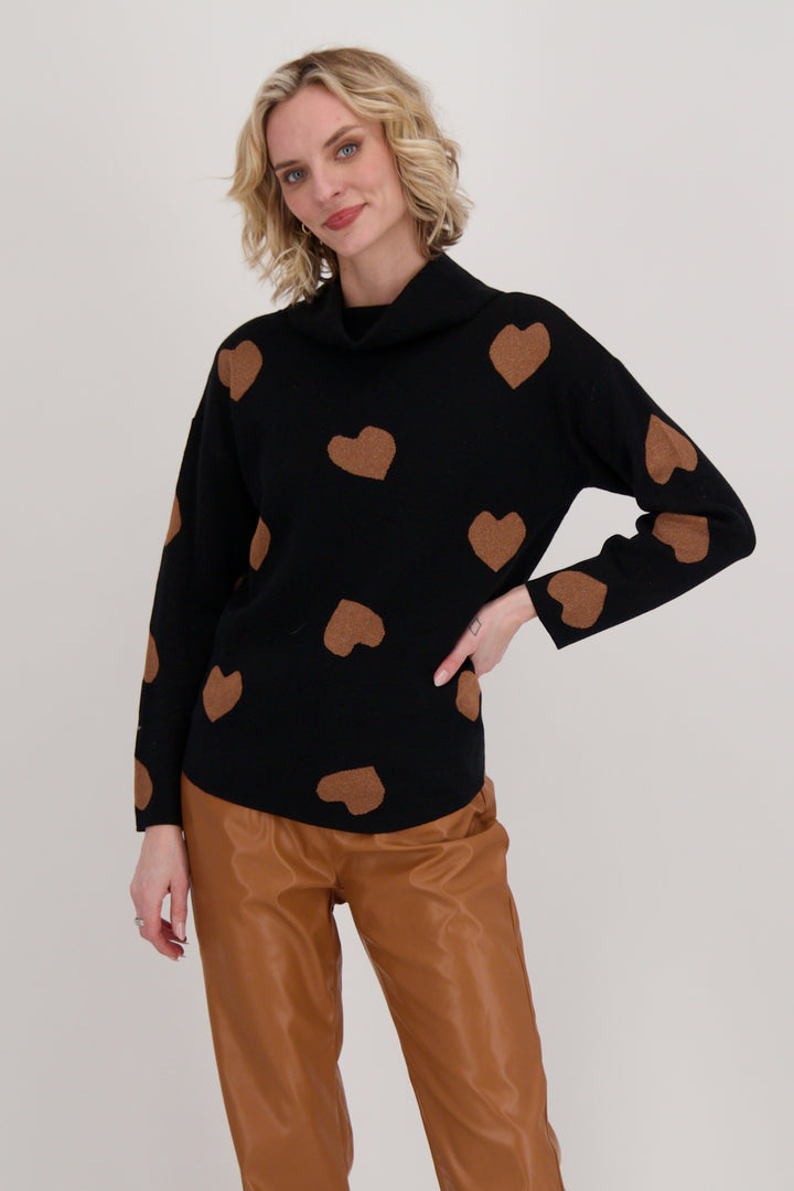 Gabby Isabella Fall 2024 This comfy and stretchy light sweater features a stunning hearts print all-over with neat tie-knot knit detail along the back.