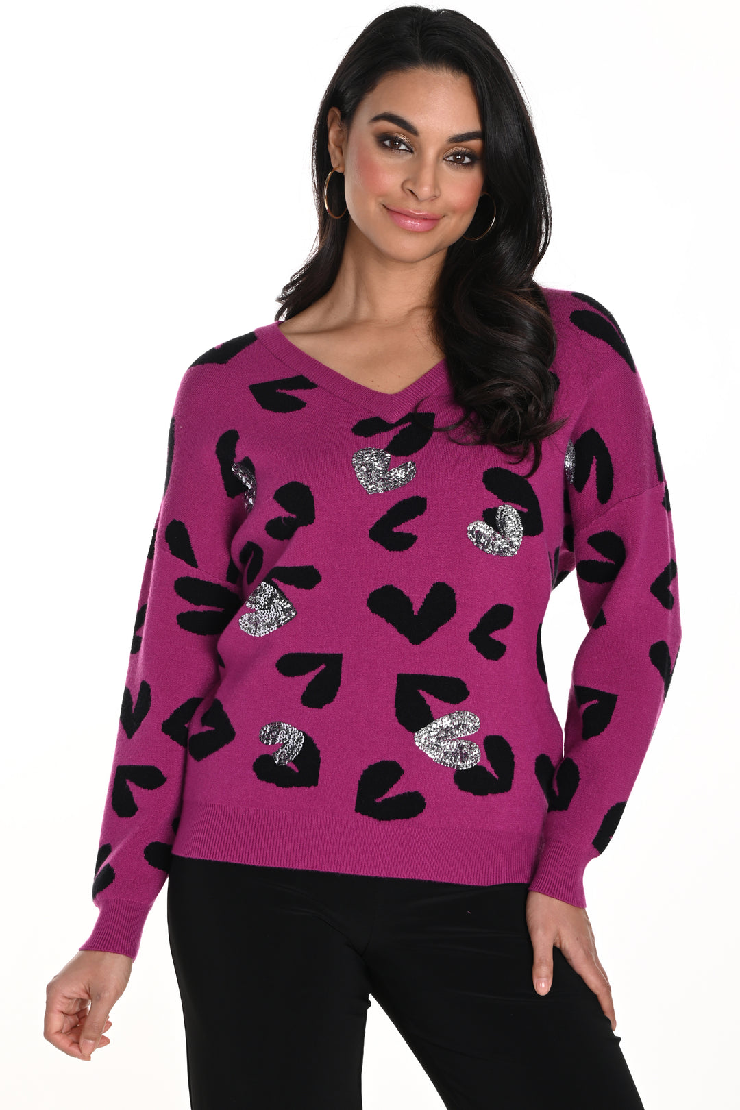 Frank Lyman Fall 2024  The neat v-neck cut and light knit sweater material provide a cozy yet elegant feel, while the playful black and silver hearts print adds a touch of fun! 