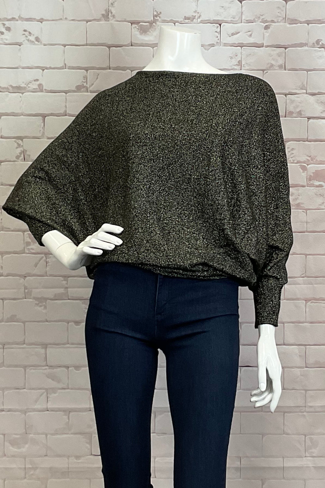 M Italy Fall 2024 This Lurex Dolman Top is perfect for any occasion- whether paired with a skirt or jeans, its neat boatneck and full length bat sleeves provide a tailored and stylish look.