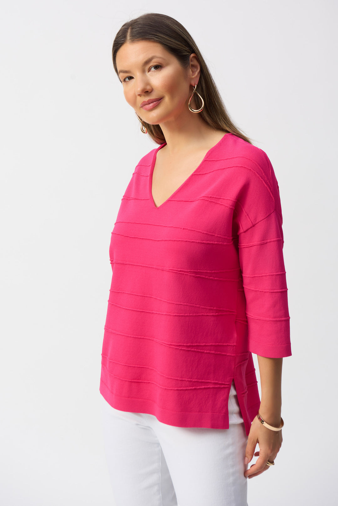 Joseph Ribkoff Spring 2025 Made from a soft blend of fabrics, it features 3/4 length sleeves and a wide v-neck that can be worn multiple ways.