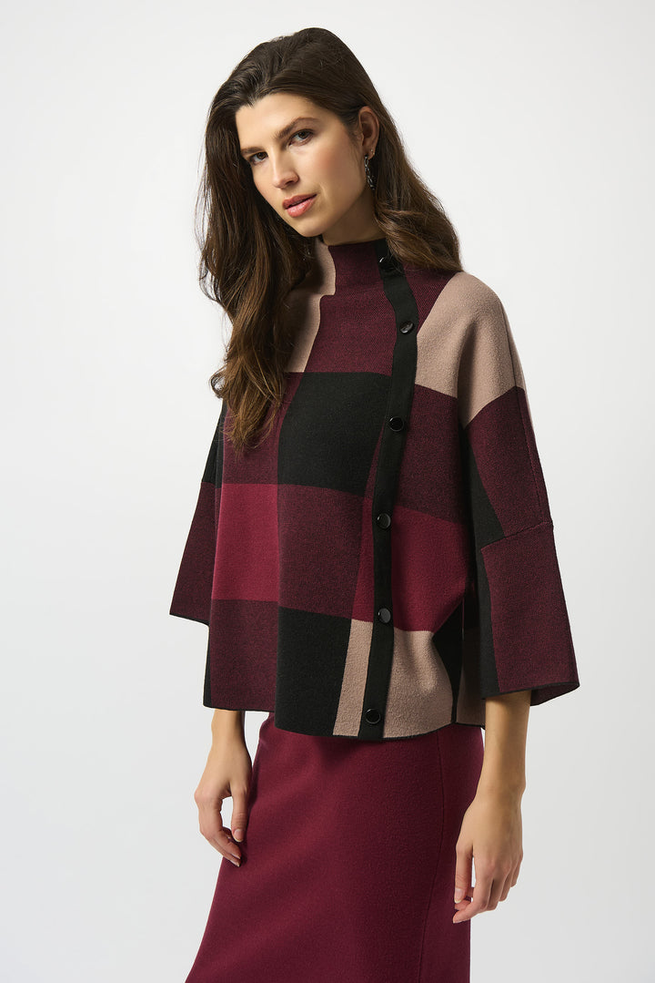 Joseph Ribkoff Fall 2025 
 Its trendy knit design features a classic plaid print, a mock neck and a front button detail. 