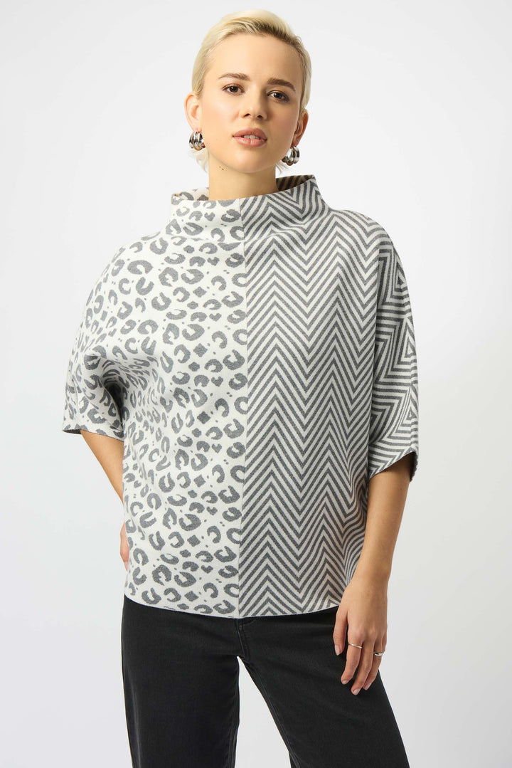 Joseph Ribkoff Fall 2025 
The relaxed, boxy fit with drop shoulder half sleeves offers effortless comfort and a contemporary silhouette. This top combines bold patterns with refined design, making it a distinct piece for modern, confident style.